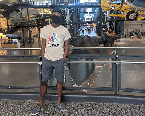 Sidney Boakye in the space museum in a NASA tshirt. 